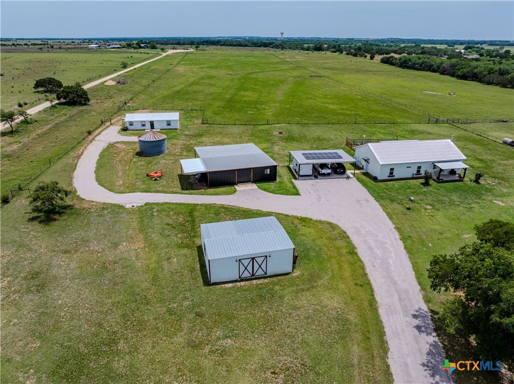 Welcome to your dream retreat on nearly 12 ag-exempt acres of fully fenced and cross-fenced land! This beautifully maintained 3-bedroom, 2-bathroom home offers the perfect blend of comfort, functionality, and modern charm
