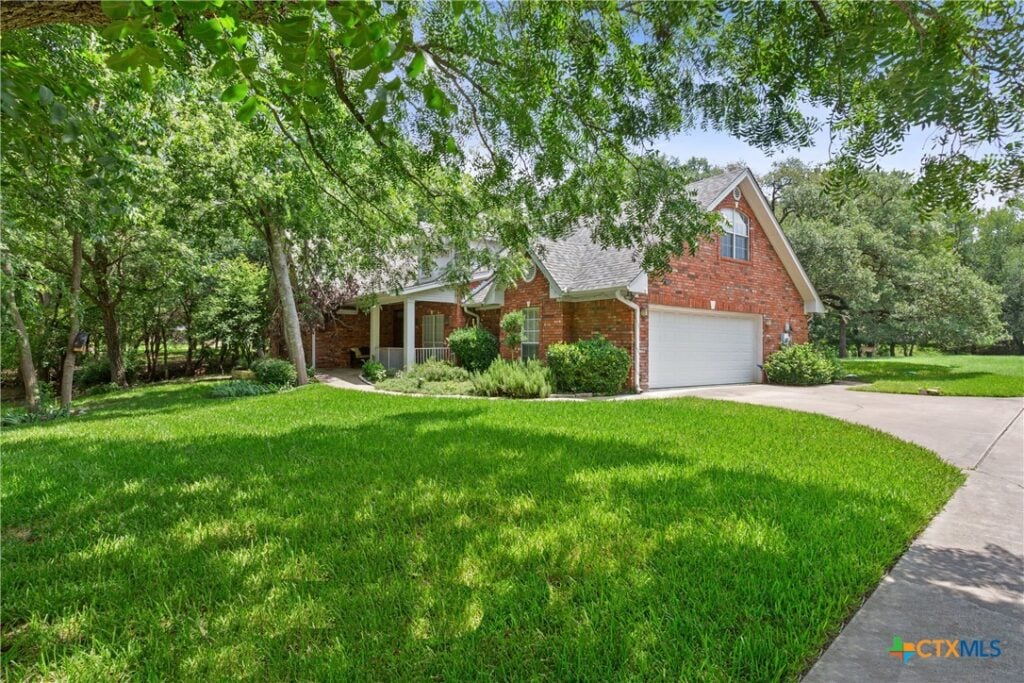 Tucked away on a heavily wooded 0.7-acre lot in the desirable Mill Creek community, this 3-bedroom, 2