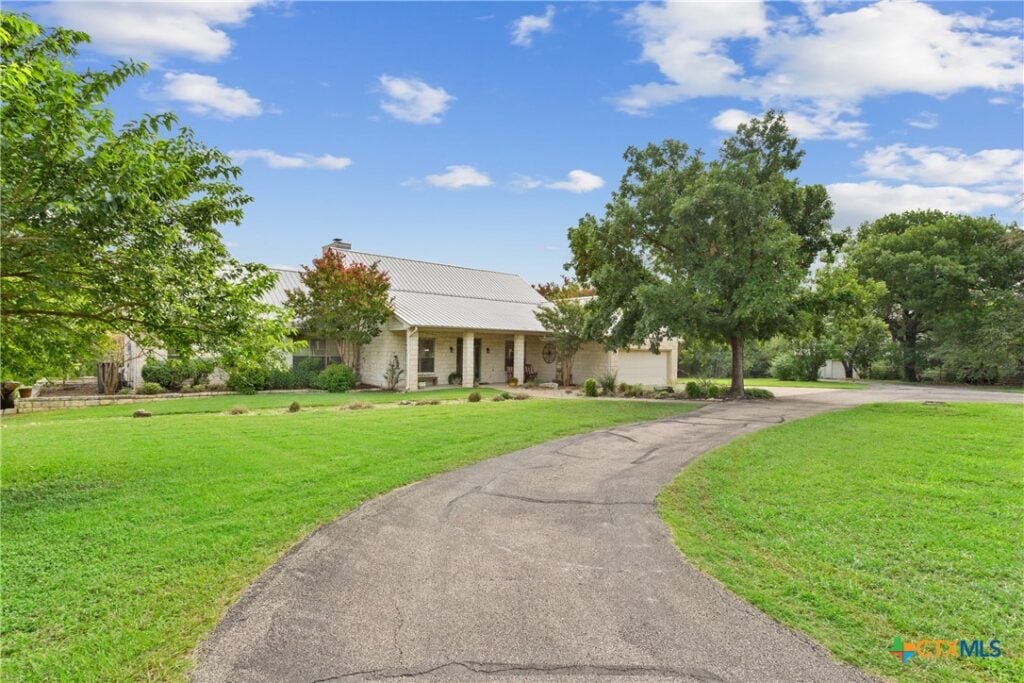 Discover this private haven tucked away on over 31 acres of heavily wooded land. The main home (2953+/- SF) features 3 spacious bedrooms and 3 full bathrooms, with a durable metal roof and charming rock exterior